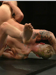 Big-dicked muscle hunks with perfectly chiseled bodies fight to dominate each another on the mat with winner fucking the loser till he begs for mercy. by Naked Kombat image #7