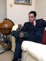 Horny Marcello wearing a pin stripe suit with bare feet and masturbating