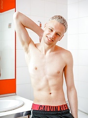 Stroking uncut teen cock in the shower