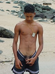 Two cute twinks at the beach sucking cock and fondling each other.