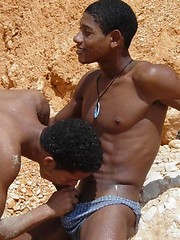Sexy black twinks fucking bareback on the beach.
