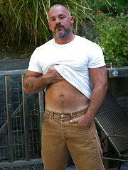 Muscle bear Bronson Gates shows his hairy muscle body and cock outdoors