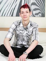 Skinny twink Kyle tugs on his uncut cock.