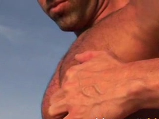 Vic Rocco naked on a beach