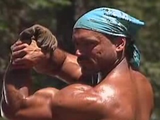 Big muscled gay working in the woods showing his hot body