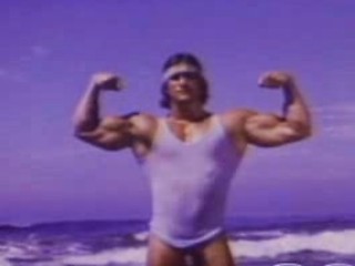 At the beach, an exhibitionist is showing his sexy curves