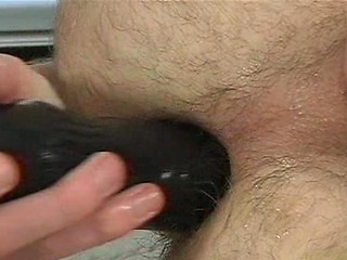 Brunette twink Kex Lyle plays with a dildo
