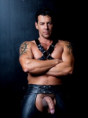 Muscle man in leather pants. by Colt Studio image #6