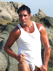 Stud Marcello at the beach wearing a white thong and playing with his cock by With Marcello image #6