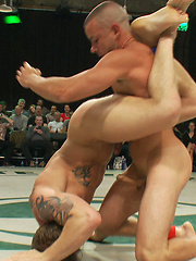 Four big dicked muscle studs fight it out to win the right to humiliate and fuck the losers in front of a live crowd in this brutal tag team match. by Naked Kombat image #7