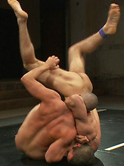 Two hot bodied studs push each other to the limit on the mat and then push each other over the edge with a brutal suck and fuck session. by Naked Kombat image #6