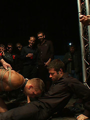 Studly Shane Frost gets tied up in the sling and fucked in front of 50 horny guests. by Bound in Public image #9