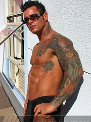 Jock poses outside and jerks off on bed by Mark Wolff image #6