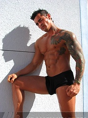 Jock poses outside and jerks off on bed by Mark Wolff image #6