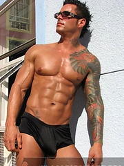 Jock poses outside and jerks off on bed by Mark Wolff image #6