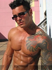 Jock poses outside and jerks off on bed by Mark Wolff image #6