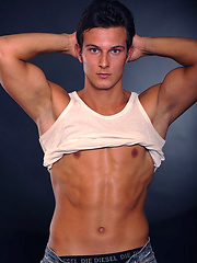 Hot brunette stud posing naked and shows his butt by William Higgins image #6