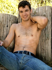 Bridge Layne finds a nice sunny spot on the farm to play with his nipples, tease his hole and stroke his big meaty dick. by Randy Blue image #6