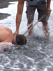 Amateur video of Micah Andrews being used and abused on a public beach. by Bound in Public image #13