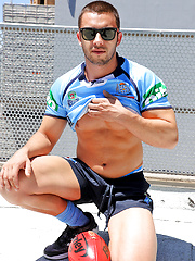 James Nowak strips out of his rugby gear on the roof by Bentley Race image #6