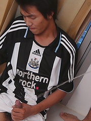 Watersports loving twinks soak each other while still wearing their favorite football kits. by Gay Asian Piss image #8