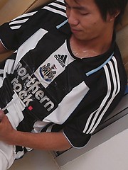 Watersports loving twinks soak each other while still wearing their favorite football kits. by Gay Asian Piss image #8