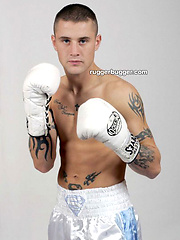 The heavily tattooed tough guy demurely stands on the scales covering his cock and balls by Ruggerbugger image #5