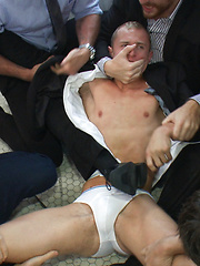 Corporate cunt gets his mouth and ass violated by a mob of horny men.  by Bound in Public image #19
