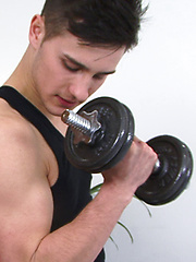 Young guy picks up a dumbbell by English Lads image #3