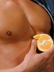 Michael Davids squeezes orange juice all over ripped body. by BF Collection image #7