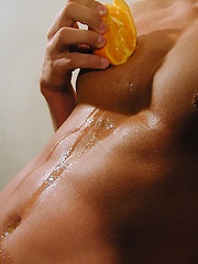 Michael Davids squeezes orange juice all over ripped body. by BF Collection image #7