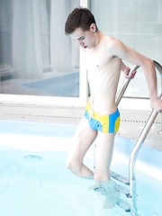 Russian twink Vitali Kutcher floats in the pool with a hard cock.