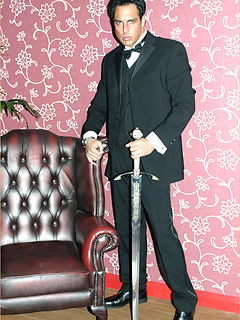 Marcello smoking a cigar in his tuxedo and then rubbing his hard dick