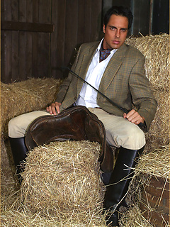 Marcello dressed in full riding suit masturbating in the stables
