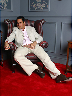 Marcelllo wearing a white suit and jerking his big dick