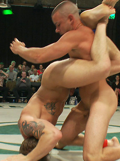 Four big dicked muscle studs fight it out to win the right to humiliate and fuck the losers in front of a live crowd in this brutal tag team match. by Naked Kombat by Naked Kombat image #7