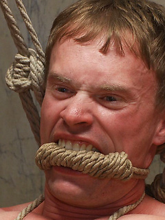 A sexy stud ends up being manhandled, bound, suspended and gang fucked, when he goes to a public restroom to service the horny men cruising there.