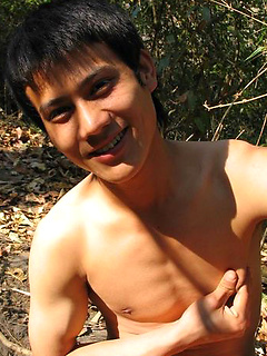 Handsome Thai guy gets naked in the wild