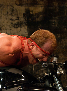 All Slicked Up Josh West ties Derek Pain to his motorcycle and machine fucks him. by Bound Gods by Bound Gods image #9