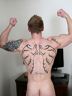 Big muscled jock Nathan shows his perfect tattooed body