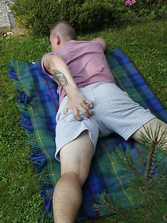 Joshua Czech lays a blanket down outside and busts a nut. by BF Collection by BF Collection image #2