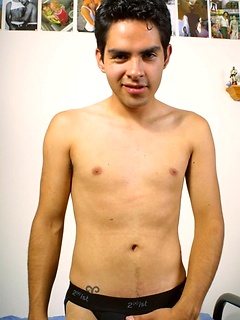 Cute uncut Latin twink fingers his ass.