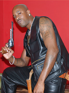 Gay black stallion wearing leather pulls his huge erection hard
