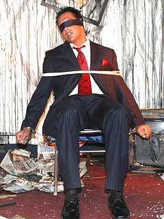 Marcello is tied up in a burnt out house by a masked man, who then apologises by licking his feet and sucking his big hard cock by With Marcello by With Marcello image #2