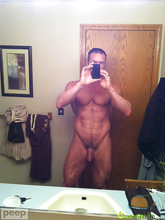 Muscular guy plays with his cock & cums
