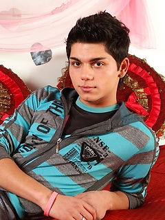Latin twink Angelo strokes his thick cock.