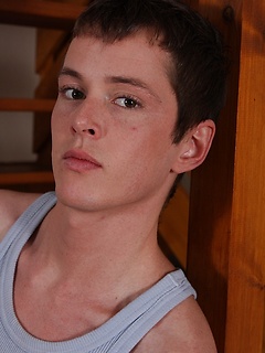 Cute twink Alex strokes his cock in a flipped over chair. by BF Collection by BF Collection image #1