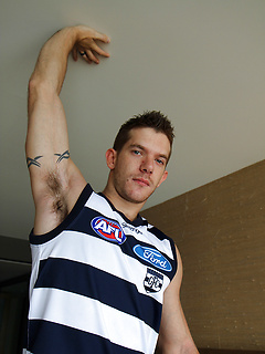 Hunky mate Skippy Baxter strips out of his footy gear by Bentley Race by Bentley Race image #1