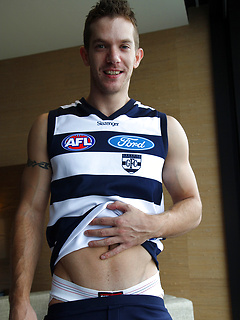 Hunky mate Skippy Baxter strips out of his footy gear by Bentley Race by Bentley Race image #4
